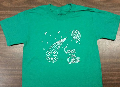 Moon with a shooting clover in the sky t-shirt